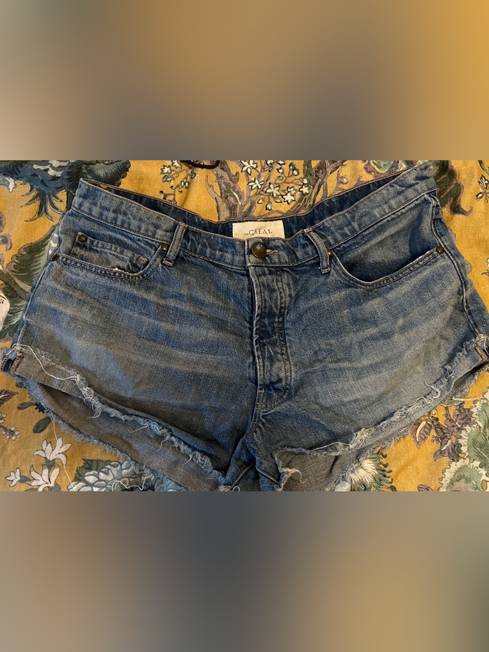 THE GREAT. Distressed Blue Denim Shorts with Frayed Hem